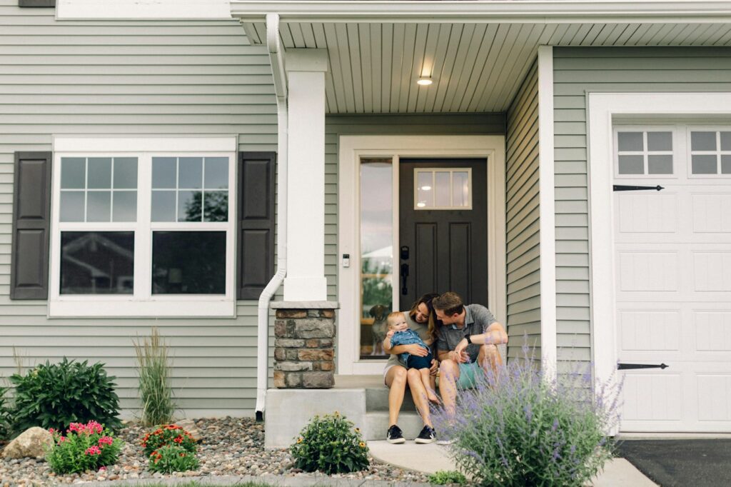 Home buyers outside a house during a real estate transaction