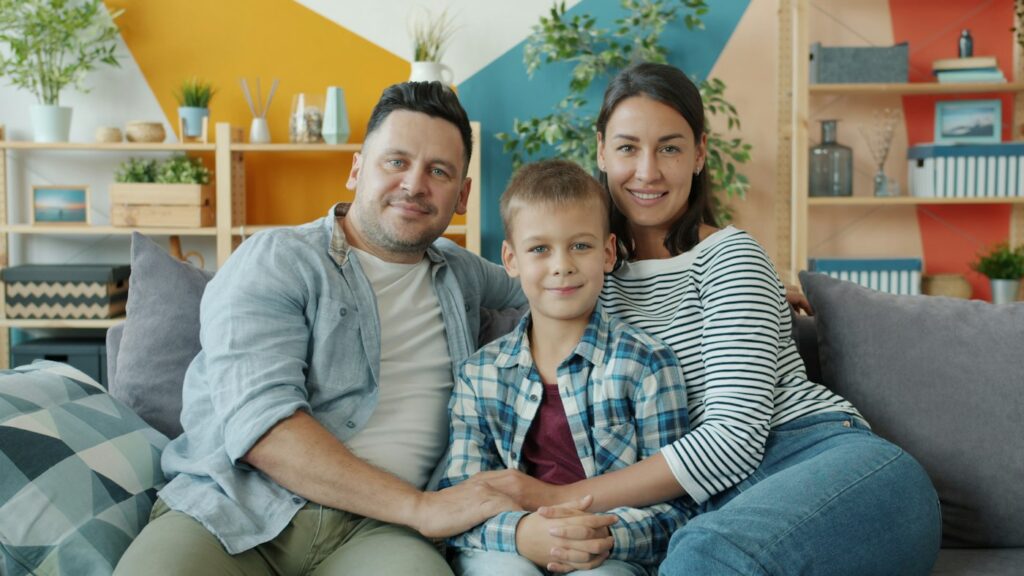 Happy family relaxing at home after radon mitigation